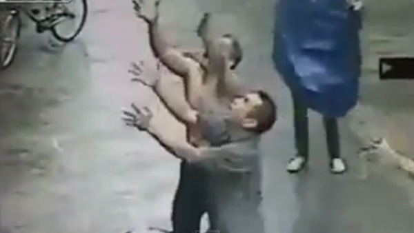 man catches baby in China
