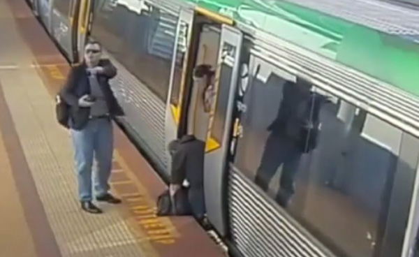 man stuck on train saved by people