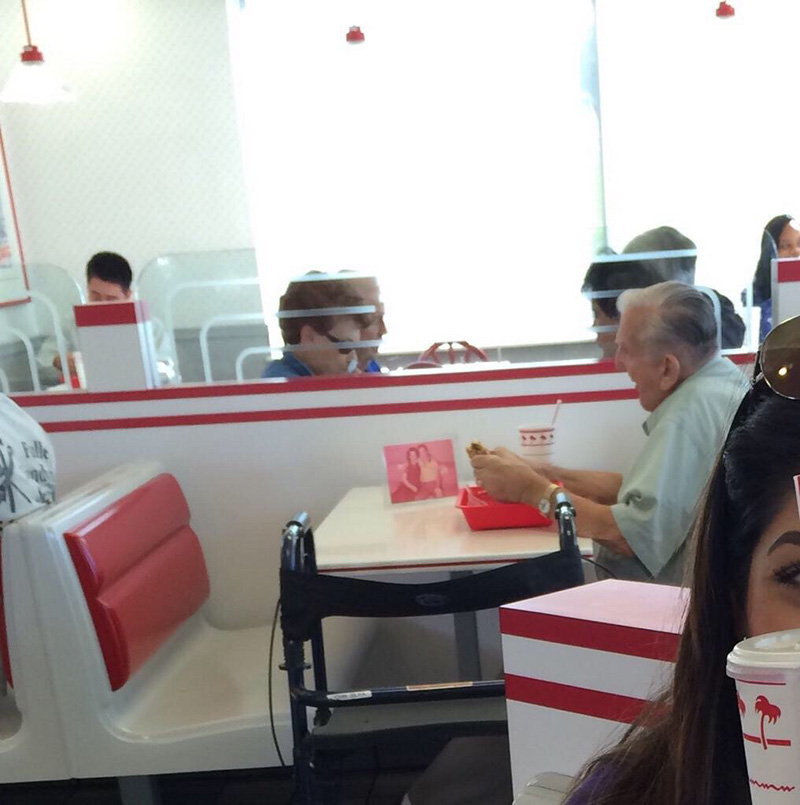 old man eats alone with wifes picture