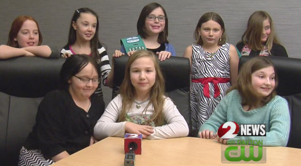 girl scouts give money raised to woman who lost home