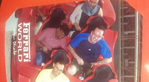 man brings taxi driver on roller coaster