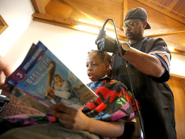 barber gives free haircut to kids who read to him