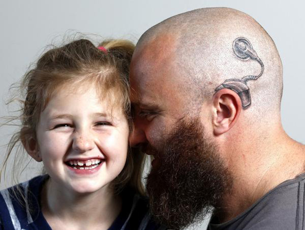 dad gets tattoo of hearing device for daughter