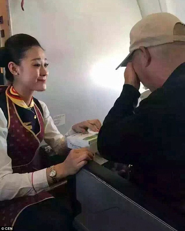 flight attendant feeds disable man