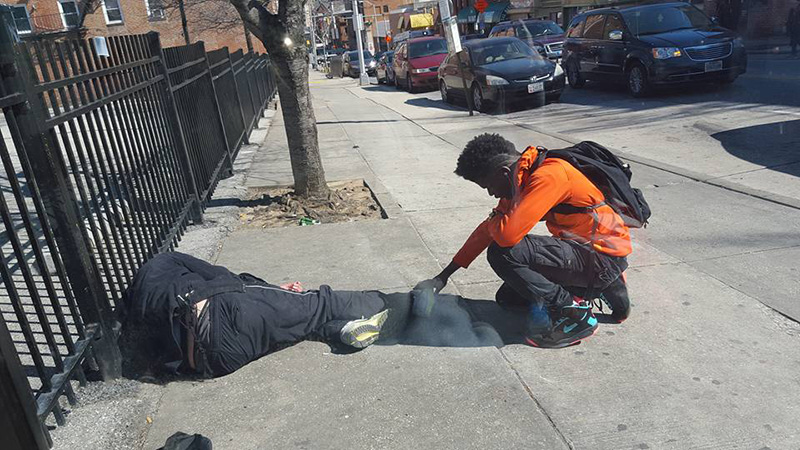 boy praying for homeless man Baltimore