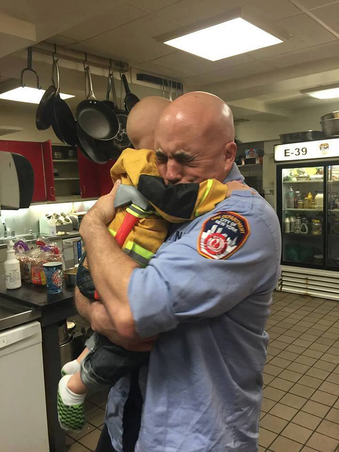 firefighter cancer boy hug photo