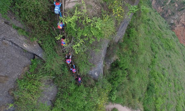 chinese students climb mountain to get to school 