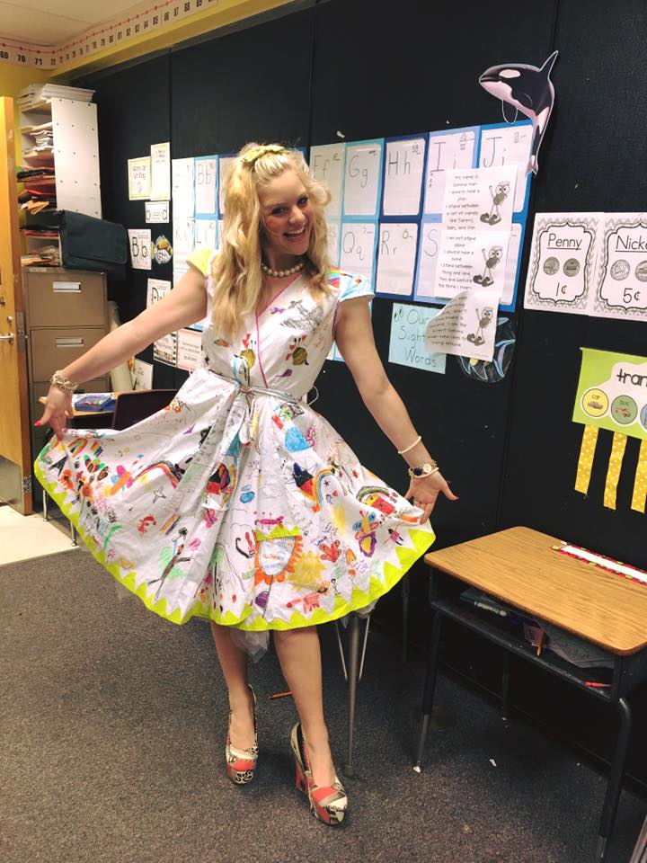 teacher wears dress decorated by students