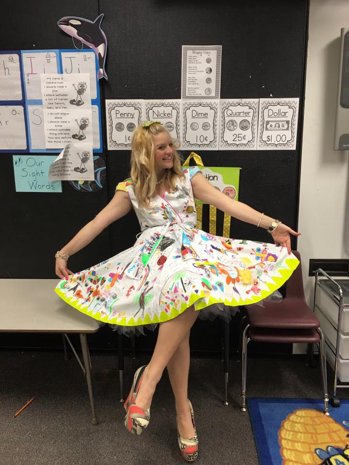 teacher wears dress decorated by students