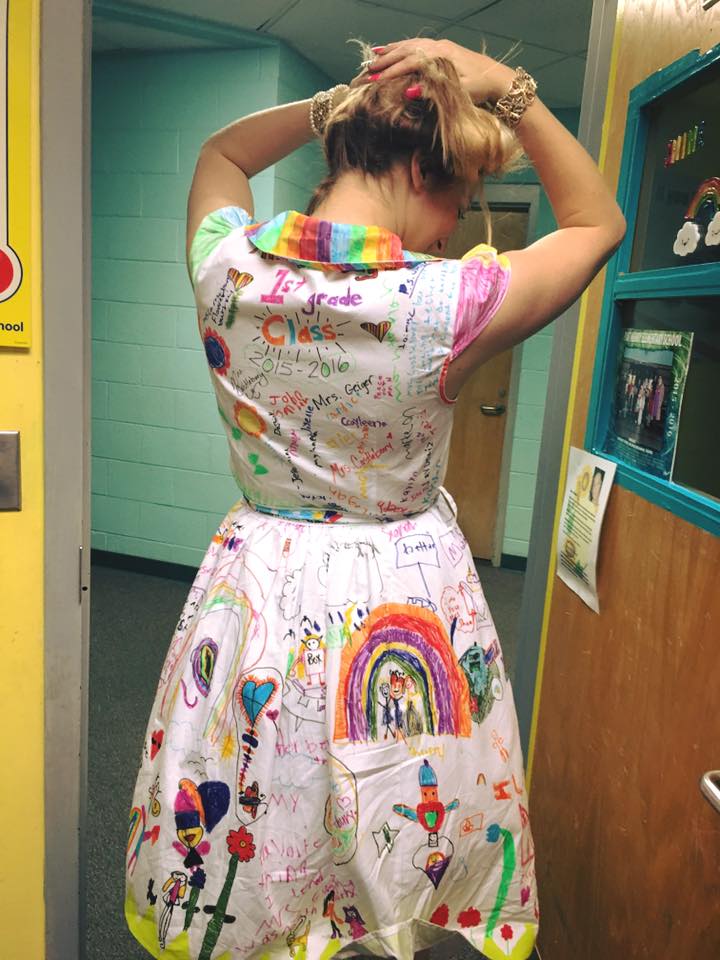 teacher wears dress decorated by students
