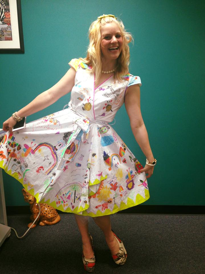 teacher wears dress decorated by students