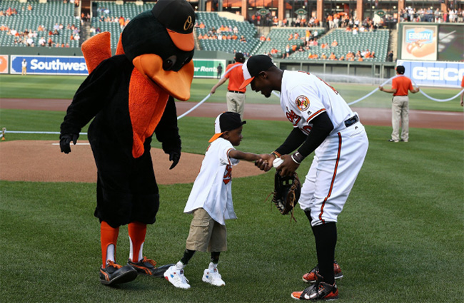 boy double hands transplant throws first pitch Orioles