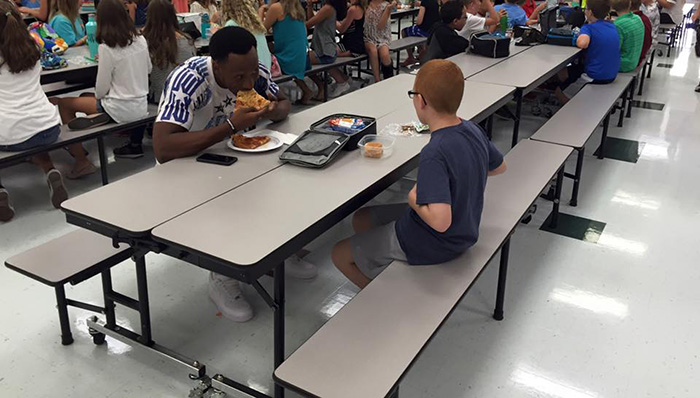 Florida State football player eats lunch with boy autism
