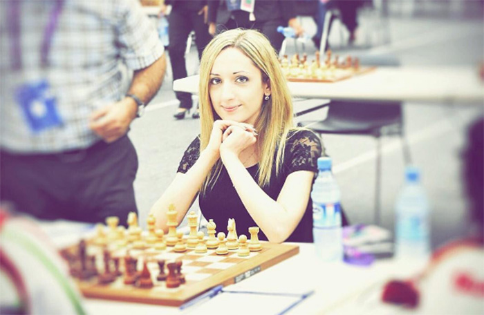 woman chess champion refuses to wear hijab in Iran