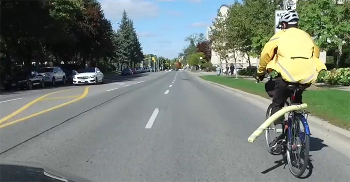 guy put pool noodle on bike for safety