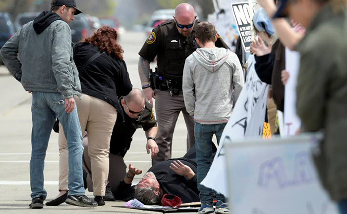 trump supporter collapses protesters provide care