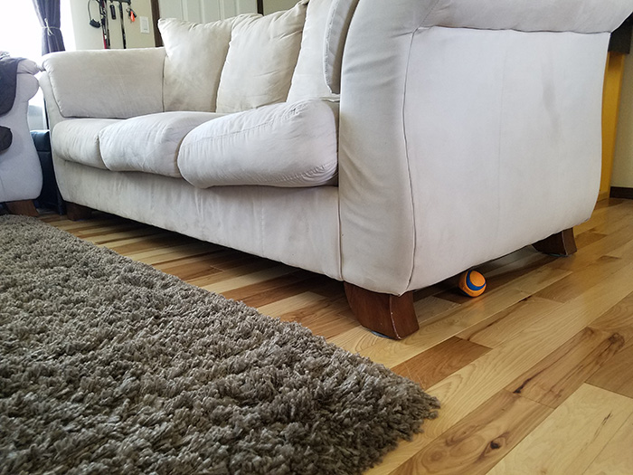 pipe insulation under couch for dog toys