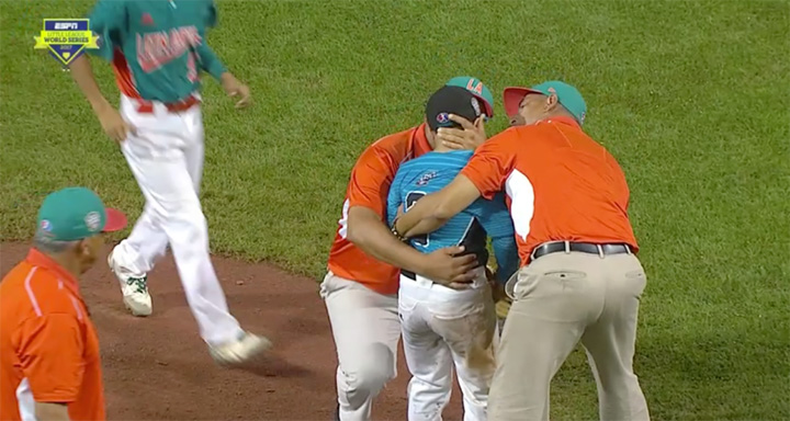 opposing coaches console pitcher after loss