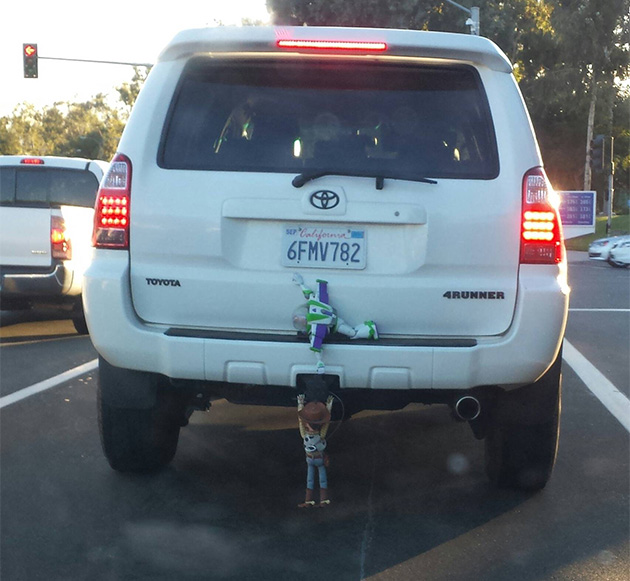 woody and buzz lightyear on a car