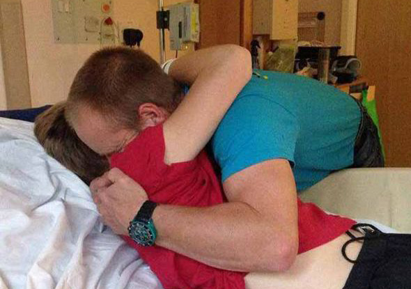 boy awakes from coma to hug dad