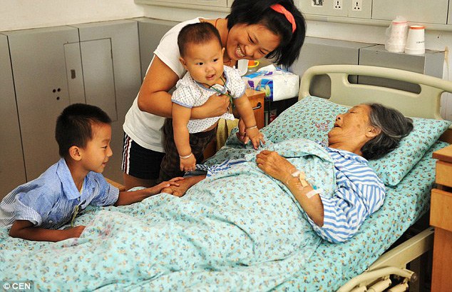 China woman visited by people she saved