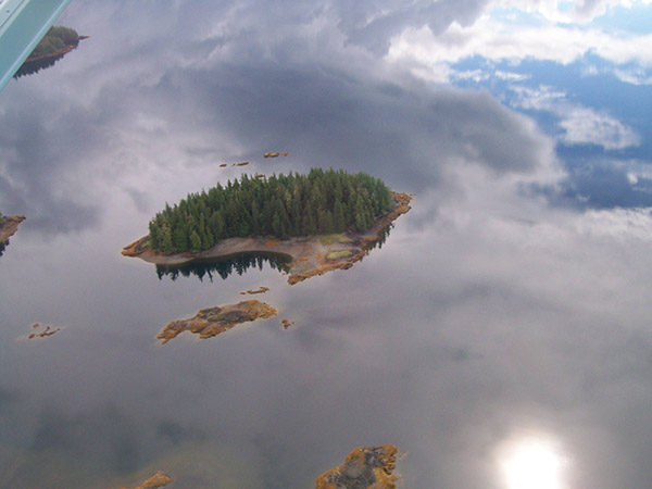 sky refelction on lake looks floating islands