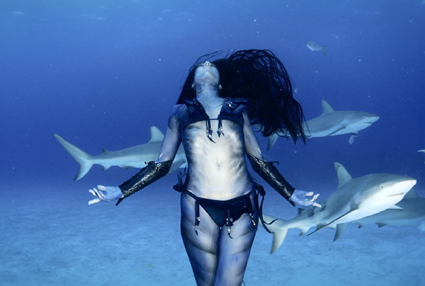 woman dances with sharks