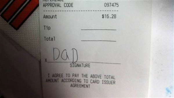 kid signs receipt dad