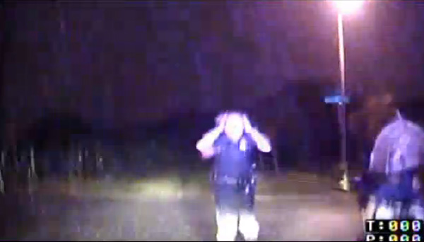 cop helps man in rain