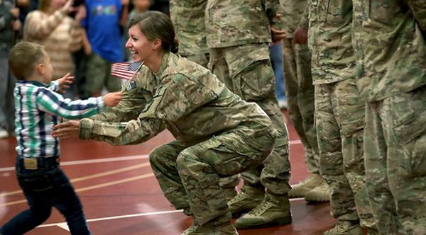 toddler runs into moms arms military