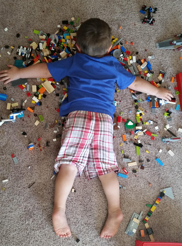 Kid Asleep On LEGOs