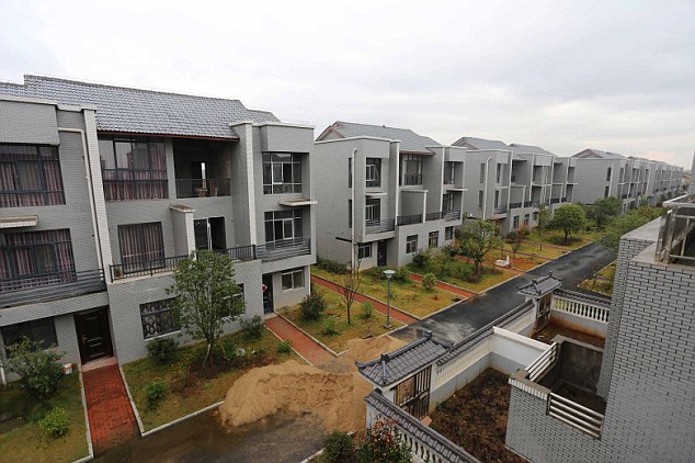 Chinese millionaire buys homes for poor