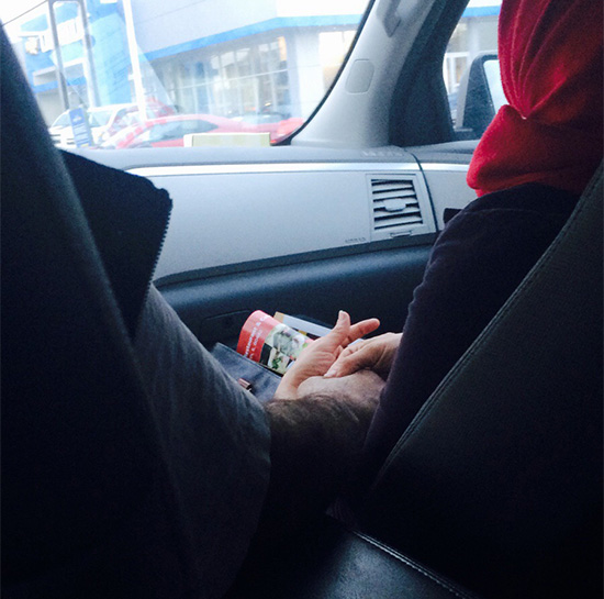 parents hold hands in car 22 years