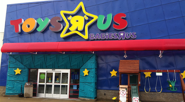 woman pays Toys R Us layaway balance