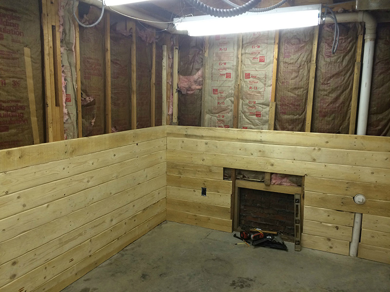 This Guy Spent $100 Turning A Basement Room Into A Rustic Cabin Getaway