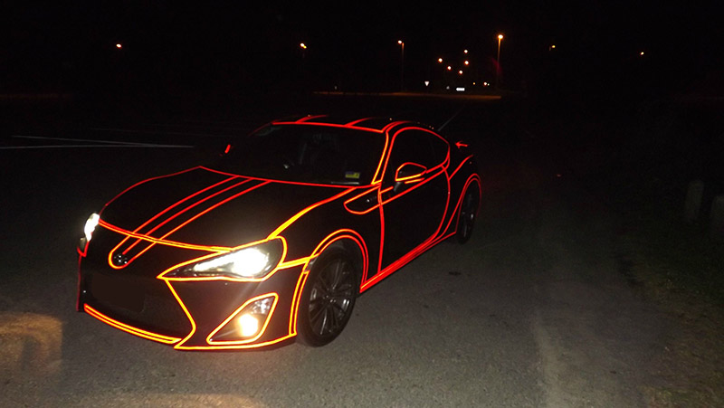 Inspired By Tron, He Put Reflective Tape All Over His Car. It Looks