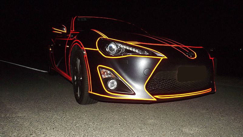 Inspired By Tron, He Put Reflective Tape All Over His Car. It Looks