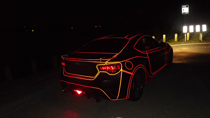 Inspired By Tron, He Put Reflective Tape All Over His Car. It Looks
