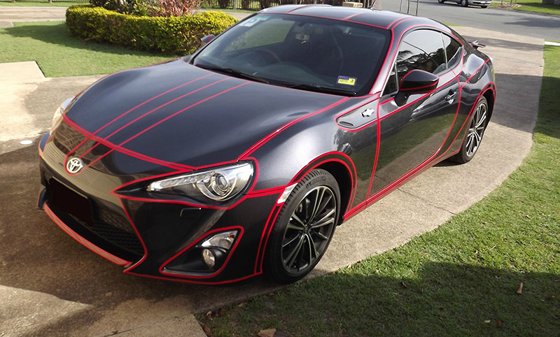 Inspired By Tron, He Put Reflective Tape All Over His Car. It Looks