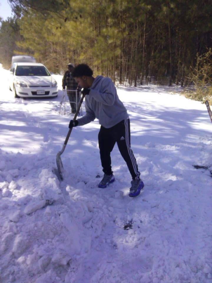 tommy shoves snow elderly man