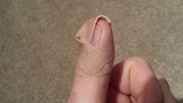 how to bandage a finger so it stays on