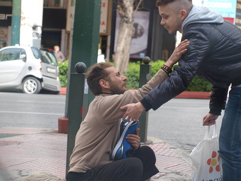 stranger gives homeless man new shoes