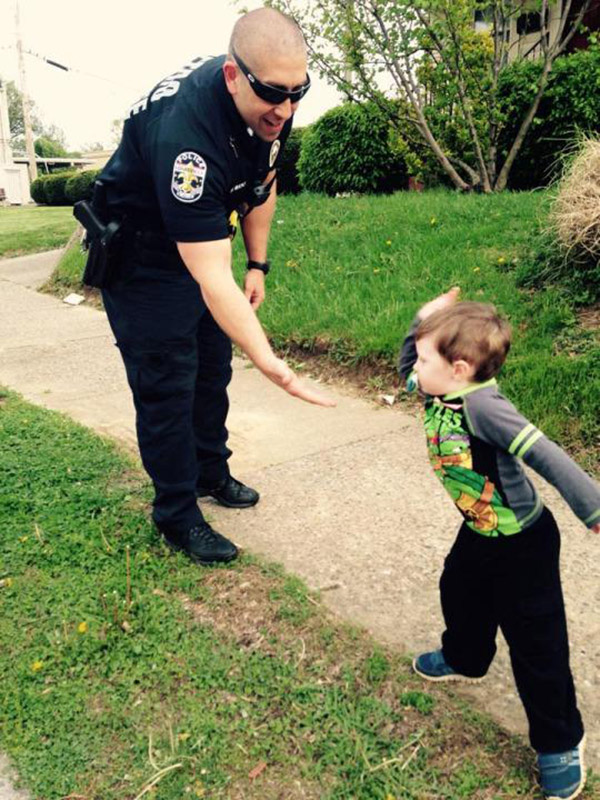 cop pulls over little kid in toy car