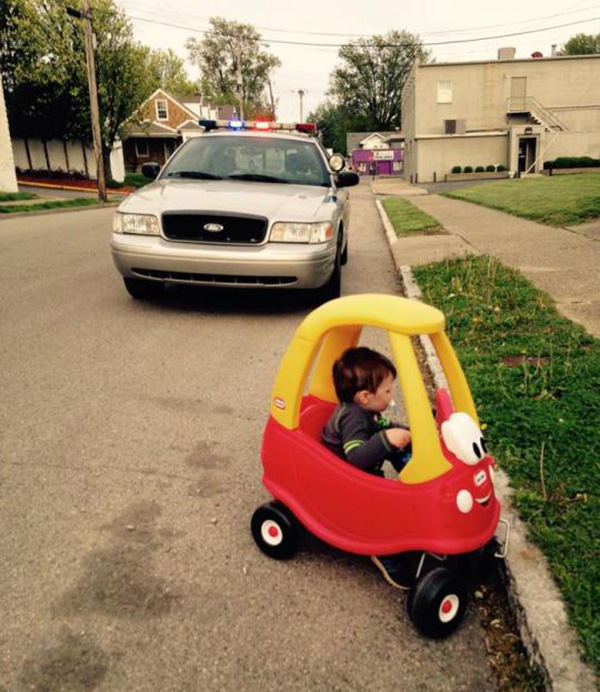cop pulls over little kid in toy car