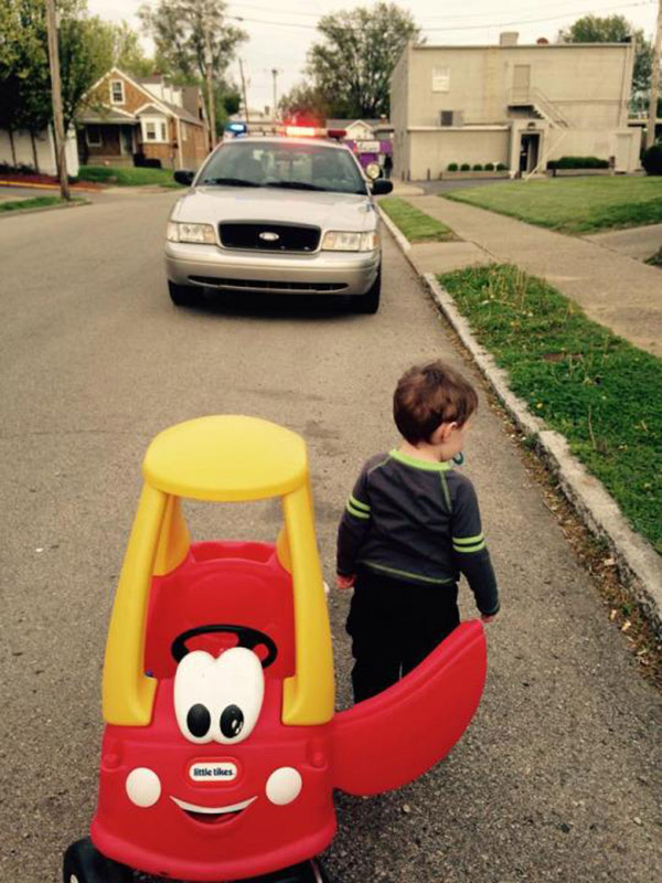 cop pulls over little kid in toy car