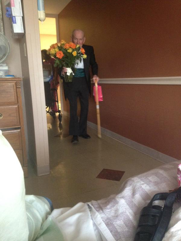 man surprises wife in hospital on anniversary tuxedo