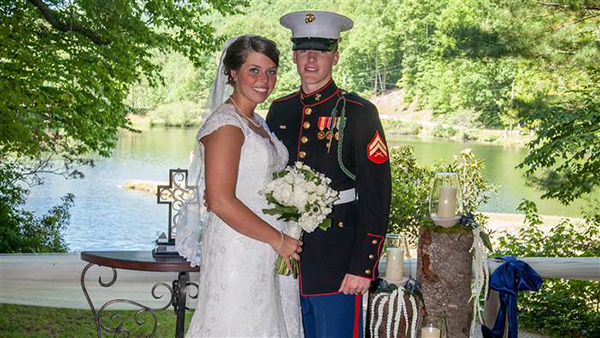 marine and bride praying