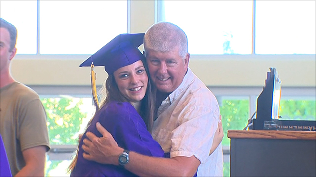 firefighter attends graduation of girl he saved as a baby