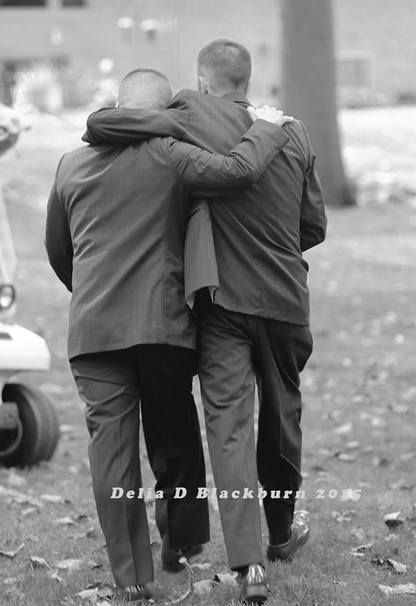 father of bride grabs father in law to walk her down aisle together