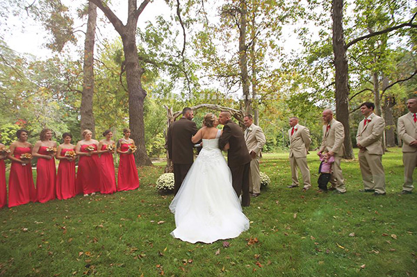 father of bride grabs father in law to walk her down aisle together